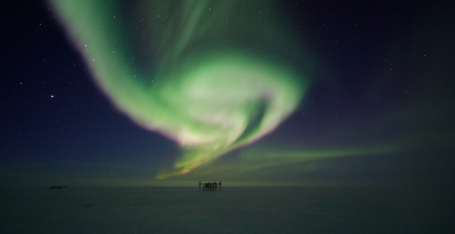 The aurora australis or Southern Lights above the IceCube Lab