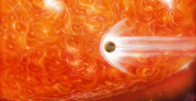 An artist's impression of a red supergiant engulfing a Jupiter-like planet as it expands (NASA)