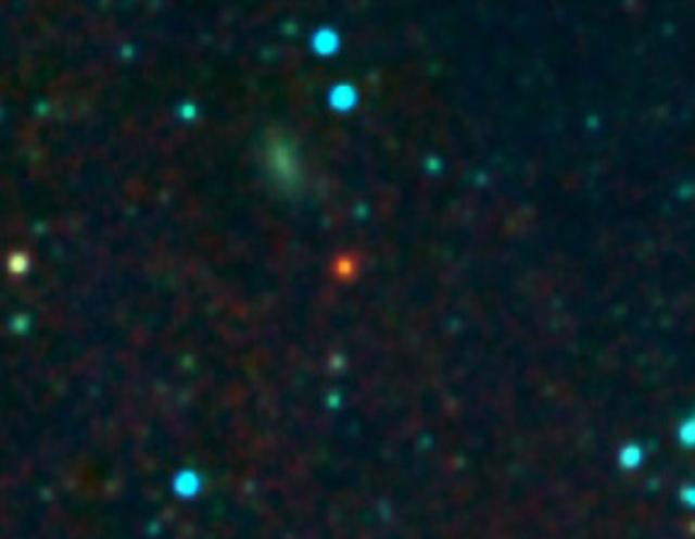 Infrared color image of ULASJ1234+0907 located 11 billion light years from Earth and one of the reddest objects in the sky. This red color is caused by the enormous amounts of dust within this system. The dust preferentially absorbs bluer light and is responsible for obscuring this supermassive black hole in the visible wavelengths (UKIDSS / Wide-Field Infrared Survey Explorer Observatory)