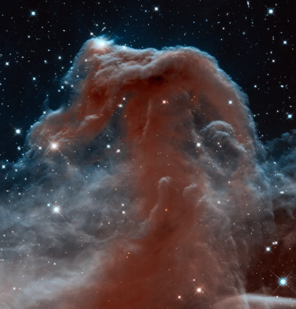 This new Hubble image shows part of the sky in the constellation of Orion. Rising like a giant seahorse from turbulent waves of dust and gas is the Horsehead Nebula, also known as Barnard 33 (NASA / ESA / the Hubble Heritage Team / AURA / STScI)