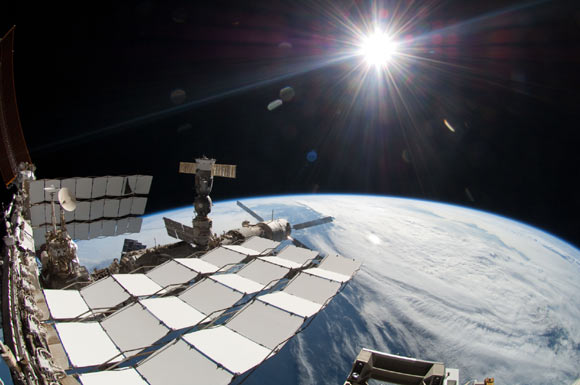 The International Space Station taken during STS-134 mission's fourth spacewalk. The Alpha Magnetic Spectrometer (AMS) was installed one week earlier during the mission's first spacewalk (NASA)