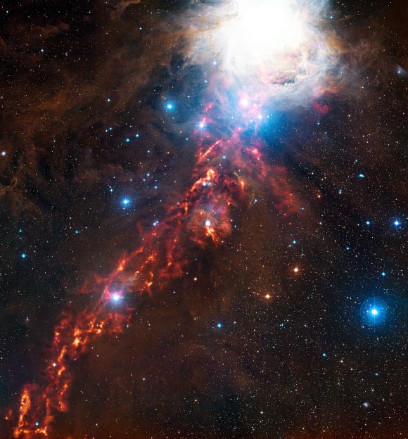 This new image of cosmic clouds in the constellation of Orion reveals what seems to be a fiery ribbon in the sky (ESO / Digitized Sky Survey 2)