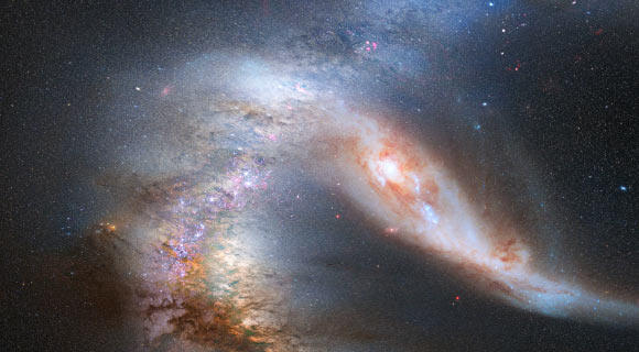 An artist’s impression shows a stage in the merger between Milky Way Galaxy and the neighboring Andromeda galaxy (NASA / ESA / Z. Levay / R. van der Marel / STScI / T. Hallas / A. Mellinger)