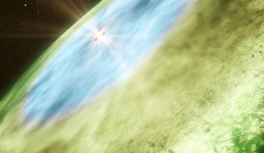 This is an artist's impression of the snow line in TW Hydrae showing water ice covered dust grains in the inner disc, shown in blue, and carbon monoxide ice covered grains in the outer disc, shown in green (B. Saxton / A. Angelich / NRAO / AUI / NSF / ALMA / ESO / NAOJ / NRAO)