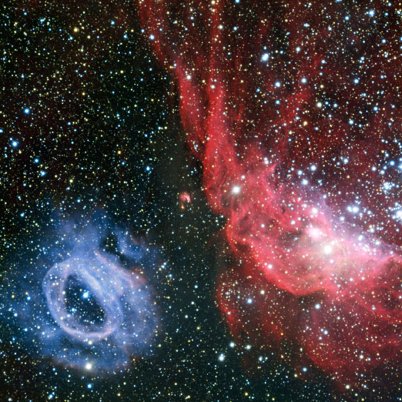 This VLT image reveals two glowing clouds of gas - NGC 2014, right, and NGC 2020 (ESO).