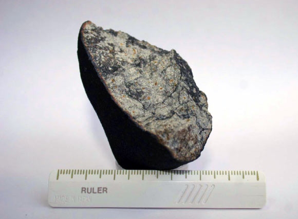 This is a fragment of the Chelyabinsk (Laboratory of Meteoritics, Vernadsky Institute, Russia).