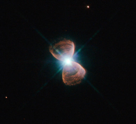 This image shows the bipolar planetary nebula PN Hb 12, popularly known as Hubble 12, in the constellation of Cassiopeia. Image credit: NASA / ESA. Acknowledgement: Josh Barrington.