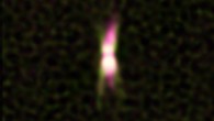 This image shows a jet of energetic particles emitting radio waves, shown in pink, coming from the star IRAS 15445-5449. Dusty material around the star, shown in green, was imaged with ESO's VLT Interferometer. The star itself is hidden by dust. Image credit: A. Pérez-Sánchez /ATCA / CSIRO / E. Lagadec / ESO.