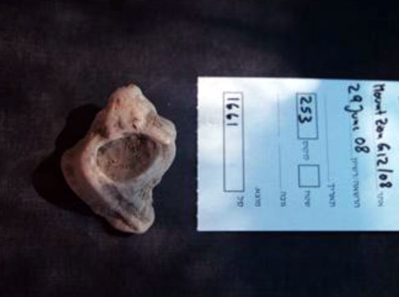 This image shows a murex snail shell from the Mt. Zion dig, associated with the site's first-century mansion. A large number of murex shells were found at the site, indicating a possible connection to the luxury dye trade. Image credit: James Tabor.