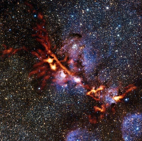 This image shows the Cat's Paw Nebula. Image credit: ArTeMiS team / Ph. André, M. Hennemann, V. Revéret et al / ESO / J. Emerson / VISTA. Acknowledgment: Cambridge Astronomical Survey Unit.