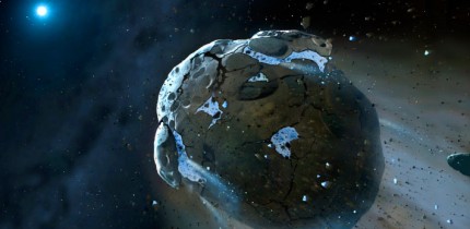 This is an artist's impression of a rocky and water-rich asteroid being torn apart by the strong gravity of the white dwarf star GD 61. Image credit: Mark A. Garlick, Space-art.co.uk / University of Warwick / University of Cambridge.