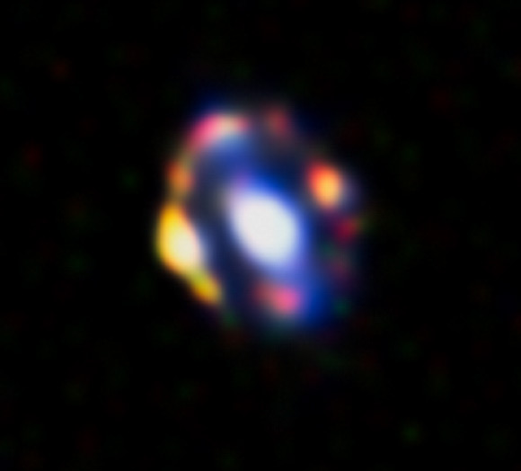 This image shows the quadruple gravitational lens J1000+0221. Image credit: NASA / ESA / A. van der Wel.