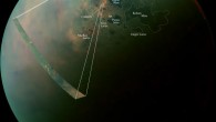 This image of Titan, taken by Cassini spacecraft, reveals differences in the composition of surface materials around hydrocarbon lakes and seas on this largest moon of Saturn. Image credit: NASA / JPL-Caltech / University of Arizona / University of Idaho.