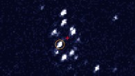 This Chandra X-ray image of the Messier 62's central region shows the black hole M62-VLA1, orange circle. A red cross marks the cluster photometric center. Image credit: Laura Chomiuk et al.