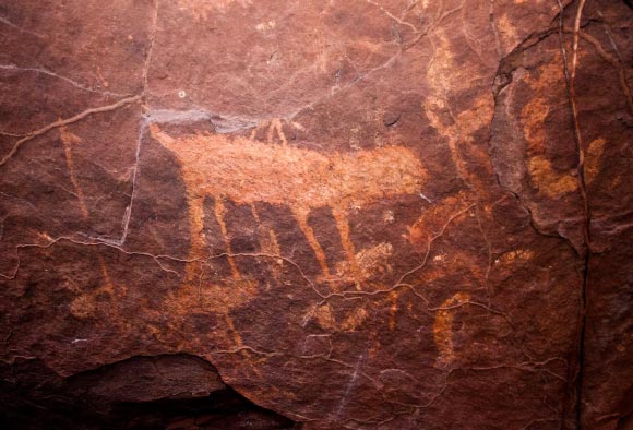 Paintings of a cat and prey in a cave in the Taboco region, the state of Mato Grosso do Sul, Brazil. Image credit: Liana Joseph / WCS.