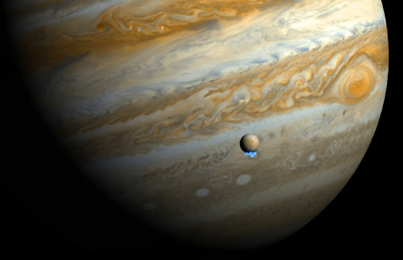 This artist's impression shows Jupiter and its moon Europa using actual Jupiter and Europa images in visible light. The Hubble ultraviolet images showing the faint emission from the newly discovered water vapor plumes have been superimposed, respecting the size but not the brightness of the plumes. Image credit: NASA / ESA / M. Kornmesser / L. Roth, Southwest Research Institute and University of Cologne / J. Saur, University of Cologne / K. Retherford, Southwest Research Institute / D. Strobel and P. Feldman, Johns Hopkins University / M. McGrath, Marshall Space Flight Center / F. Nimmo, University of California, Santa Cruz.