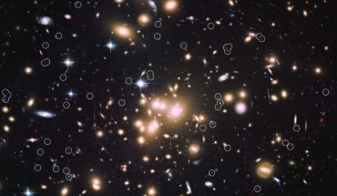 This image, taken with the Hubble Space Telescope, shows the giant galaxy cluster Abell 1689 and the newly discovered galaxies, circled. Image credit: NASA / ESA / B. Siana and A. Alavi, University of California, Riverside.