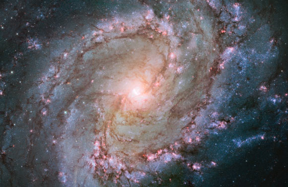 This image shows the scatterings of bright stars and thick dust that make up the barred spiral galaxy Messier 83. Image credit: NASA / ESA / the Hubble Heritage Team / STScI / AURA / William Blair, Johns Hopkins University.
