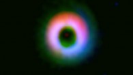 This image shows a dusty protoplanetary disk around HD142527. The dust and gas are shown in red and green, respectively; near-infrared image taken by the NAOJ Subaru Telescope is shown in blue. The image clearly shows that the dust is concentrated in the upper part of the disk. Image credit: ALMA / ESO / NAOJ / NRAO / Fukagawa et al.