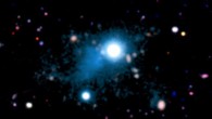 This image shows the nebula (cyan) extending across 2 million light-years that was discovered around the quasar UM 287 (center of the image). Image credit: S. Cantalupo / University of California, Santa Cruz.