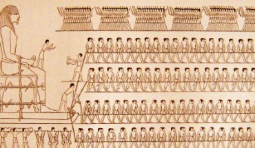 Drawing of a wall painting from the tomb of Djehutihotep, a semi-feudal ruler of an Ancient Egyptian province, 1880 BC. A person standing at the front of the sled is pouring water onto the sand.