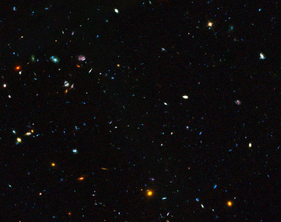 This image shows a region of space containing distant dwarf galaxies. Image credit: NASA / ESA / GOODS Team / M. Giavalisco, STScI, University of Massachusetts / H. Atek, EPFL / J-P. Kneib, EPFL.