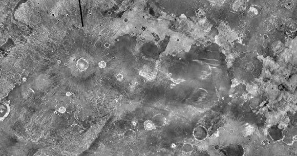 Unlike an ordinary daytime photo, this nighttime image of Martian surface shows how warm various surface areas are: brighter tones mean warmer temperatures, which indicate areas with rockier surface materials; darker areas indicate cooler and dustier terrain. Image credit: NASA / JPL-Caltech / Arizona State University.