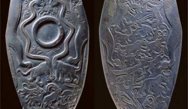 The obverse and reverse surfaces of a 5,150-year-old siltstone ceremonial palette discovered at Hierakonpolis, Egypt. The object is surmounted and framed by two wild dogs (Lycaon pictus) clasping one another’s paws; other species include ostrich, hartebeest, wildebeest, ibex, oryx, and giraffe; some fictitious animals are also depicted, including serpent-necked panthers, or ‘serpopards,’ and a plausible griffin. Image credit: Ashmolean Museum.