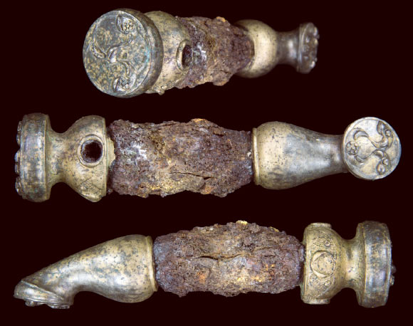 Chariot linch pin from three angles, showing the intricate decoration at the ends. Image credit: University of Leicester.
