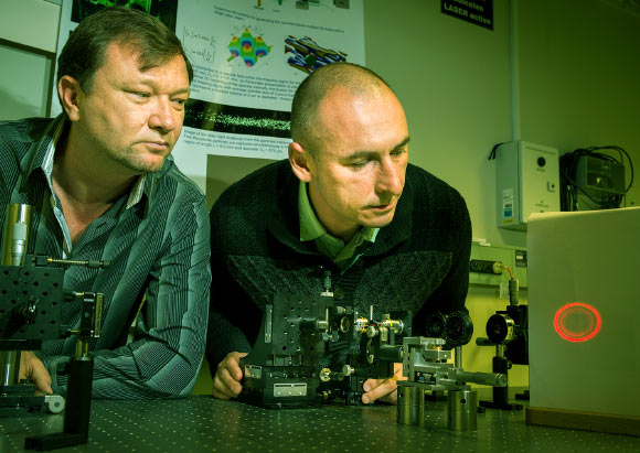 Australian National University scientists adjusting the hollow laser beam. Image credit: Stuart Hay.