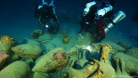 Divers illuminate artifacts of the Panarea III ship. Image credit: © Global Underwater Explorers.
