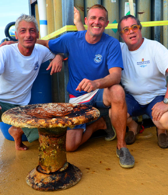 Archaeologists examine a louterion that was recovered from the site of the Panarea III shipwreck. Image credit: © Global Underwater Explorers.