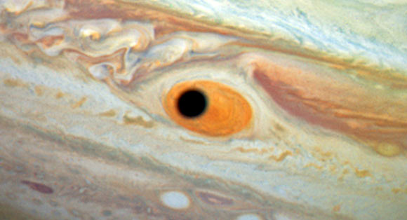 This close-up view shows the Great Red Spot and the shadow of the Jovian moon Ganymede. Image credit: NASA / ESA / A. Simon, Goddard Space Flight Center / C. Go / Hubble Heritage Team / STScI / AURA.
