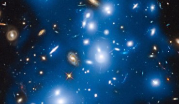 Abell 2744 takes on a ghostly look where total starlight has been artificially colored blue in this Hubble view. Image credit: NASA / ESA / IAC / HFF Team / STScI.