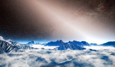 This artist's view from an imagined planet around a nearby star shows the brilliant glow of exozodiacal light extending up into the sky and swamping the Milky Way. Image credit: ESO / L. Calçada.