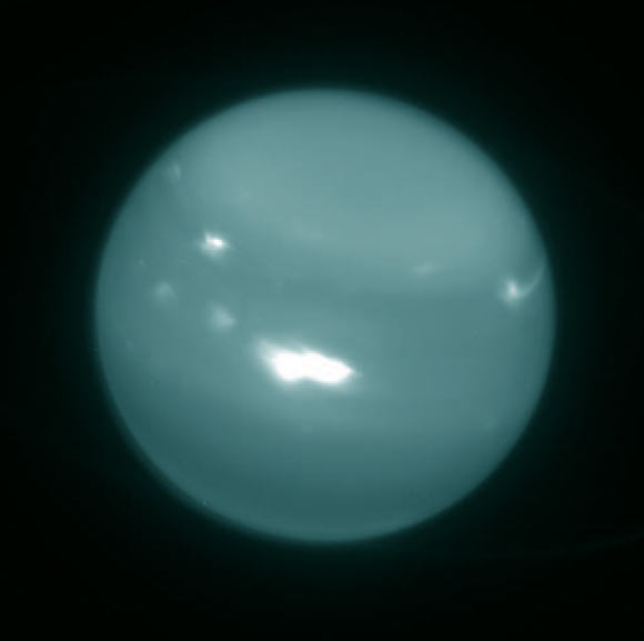 Colorized infrared image of Uranus obtained on August 6, 2014, with adaptive optics on the 10-meter Keck telescope; white spots are large storms. Image credit: Imke de Pater, University of California, Berkeley / Keck Observatory images.