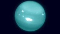 Colorized infrared image of Uranus obtained on August 6, 2014, with adaptive optics on the 10-meter Keck telescope; white spots are large storms. Image credit: Imke de Pater, University of California, Berkeley / Keck Observatory images.