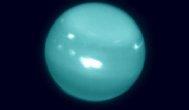 Colorized infrared image of Uranus obtained on August 6, 2014, with adaptive optics on the 10-meter Keck telescope; white spots are large storms. Image credit: Imke de Pater, University of California, Berkeley / Keck Observatory images.