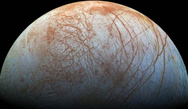 The surface of Europa looms large in this newly-reprocessed color view; image scale is 1.6 km per pixel; north on Europa is at right. Image credit: NASA / JPL-Caltech / SETI Institute.