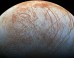 The surface of Europa looms large in this newly-reprocessed color view; image scale is 1.6 km per pixel; north on Europa is at right. Image credit: NASA / JPL-Caltech / SETI Institute.