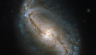 This image shows the barred spiral galaxy NGC 986. Image credit: NASA / ESA.