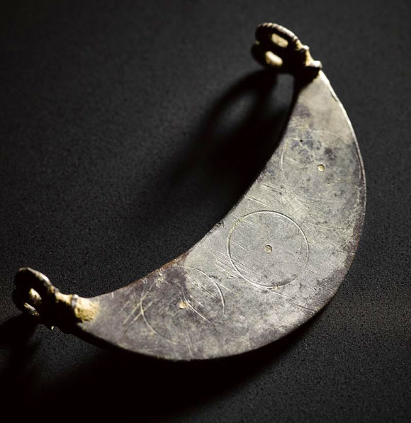 Silver crescent from the Aberdeenshire hoard. Image credit: © National Museum Scotland.