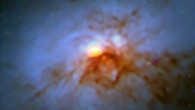 This Hubble/ALMA composite image shows the nearby lenticular galaxy NGC 1266; ALMA data are orange. Image credit: NASA / ESA / Hubble / ALMA / NRAO / ESO / NAOJ.