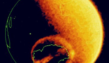 Theta aurora over Antarctica. This image obtained in 1983 shows the auroral oval and a transpolar arc; the arc extends into the polar cap from local midnight, across the polar cap and joins with the auroral oval at local noon; motion of the transpolar arc in the dawn-dusk direction appears to be controlled by the direction of the interplanetary magnetic field along the dawn-dusk direction. Image credit: Dynamics Explorer-1 / University of Iowa.