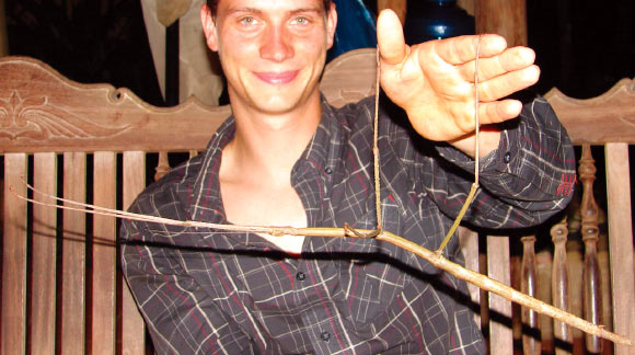 Dr Joachim Bresseel holding a 31.7-cm-long female Phryganistria heusii yentuensis. Image credit: Joachim Bresseel / Jerome Constant.