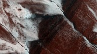 This image of an area on the surface of Mars, about 1.5 x 3 km in size, was taken by the HiRISE camera aboard the Mars Reconnaissance Orbiter on November 30, 2014. It shows frosted gullies on a south-facing slope within a crater in Sisyphi Planum. In the Martian southern spring, only south-facing slopes retain the frost, while the north-facing slopes have melted. Image credit: NASA / JPL-Caltech / University of Arizona.