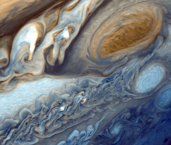 This false-color image, captured by Voyager 1, shows the Great Red Spot and a passing white oval. Image credit: NASA / JPL-Caltech.