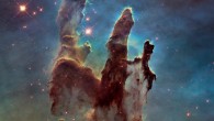 This image shows the Eagle Nebula’s Pillars of Creation as seen in visible light, capturing the multi-colored glow of gas clouds, wispy tendrils of dark cosmic dust, and the rust-colored elephants’ trunks of the nebula’s famous pillars. The dust and gas in the pillars is seared by the intense radiation from young stars and eroded by strong winds from massive nearby stars. Image credit: NASA / ESA / Hubble / Hubble Heritage Team.