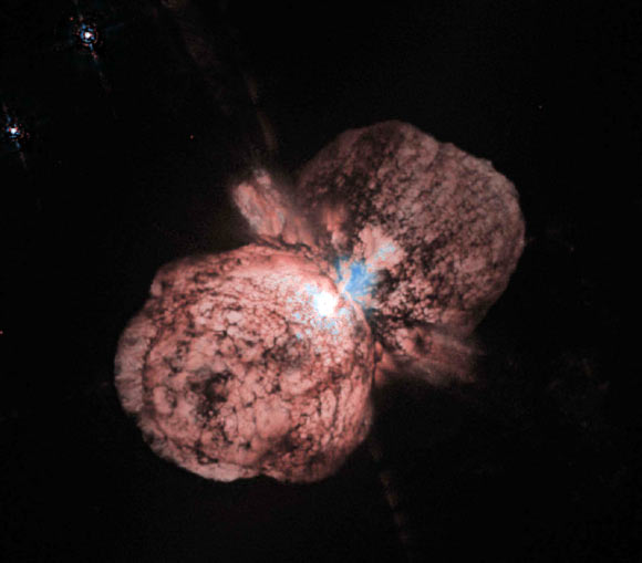 Eta Carinae's great eruption in the 1840s created the billowing Homunculus Nebula, imaged here by Hubble. Now about a light-year long, the expanding cloud contains enough material to make at least 10 copies of our Sun. Astronomers cannot yet explain what caused this eruption. Image credit: Jon Morse, University of Colorado / NASA.