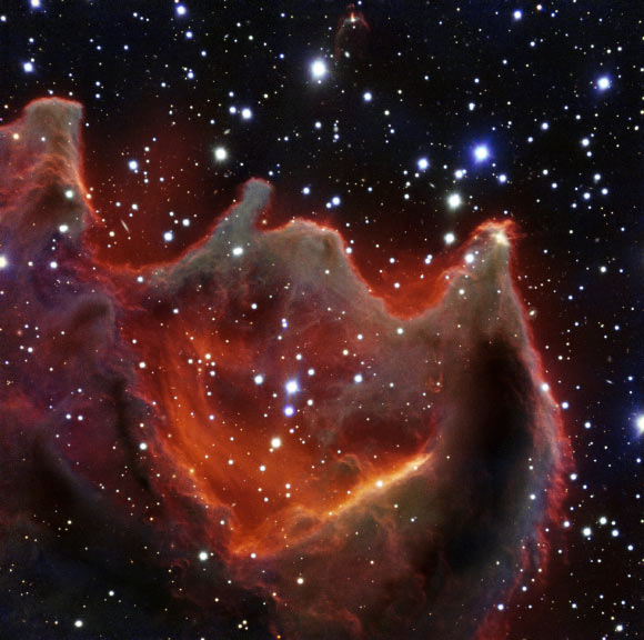 This image shows the cometary globule CG4; although it looks huge and bright in this image it is actually a faint nebula and not easy to observe; the exact nature of CG4 remains a mystery. Image credit: ESO.